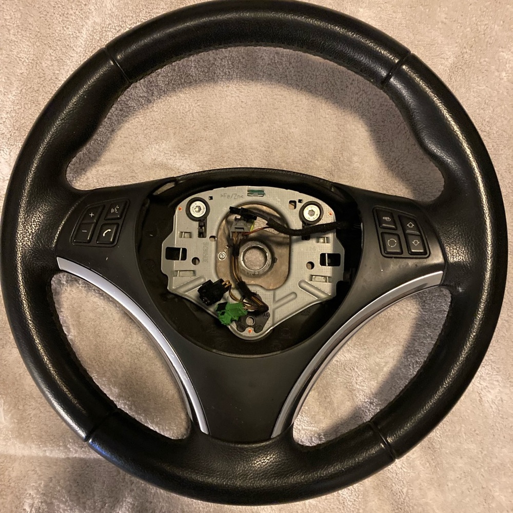 BMW steering wheel, used with very limited wear. Please review pics.